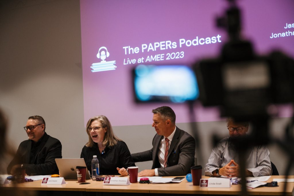 The for hosts laughing at a live session in AMEE 2023.